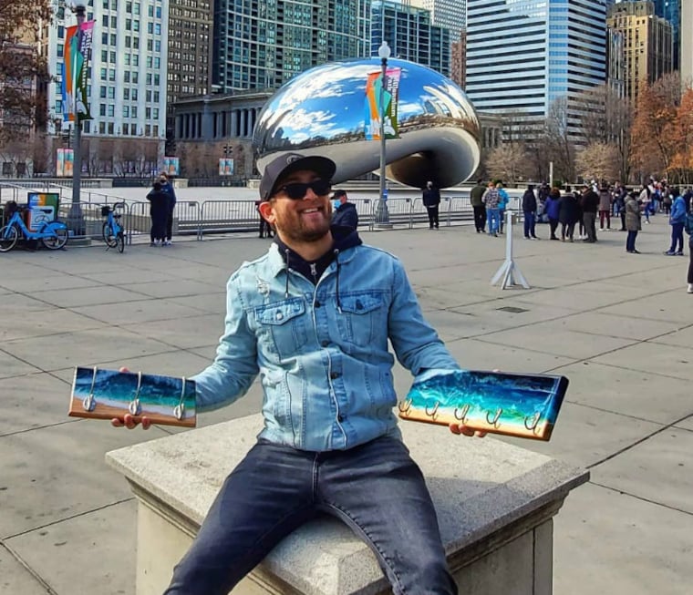 Ricardo Soto holding his handmade ocean resin racks in Chicago